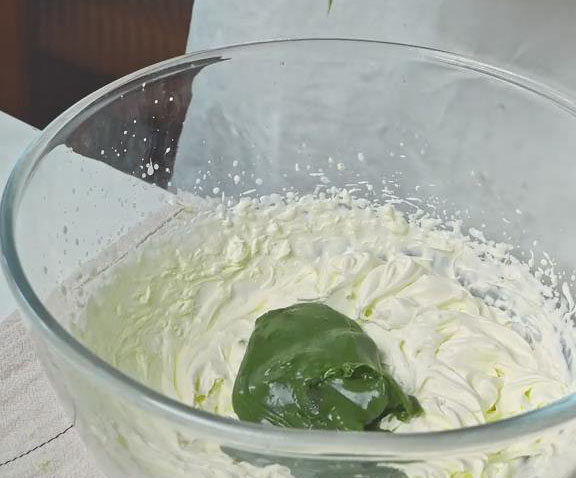 gently mix the prepared matcha ganache into the whipped cream