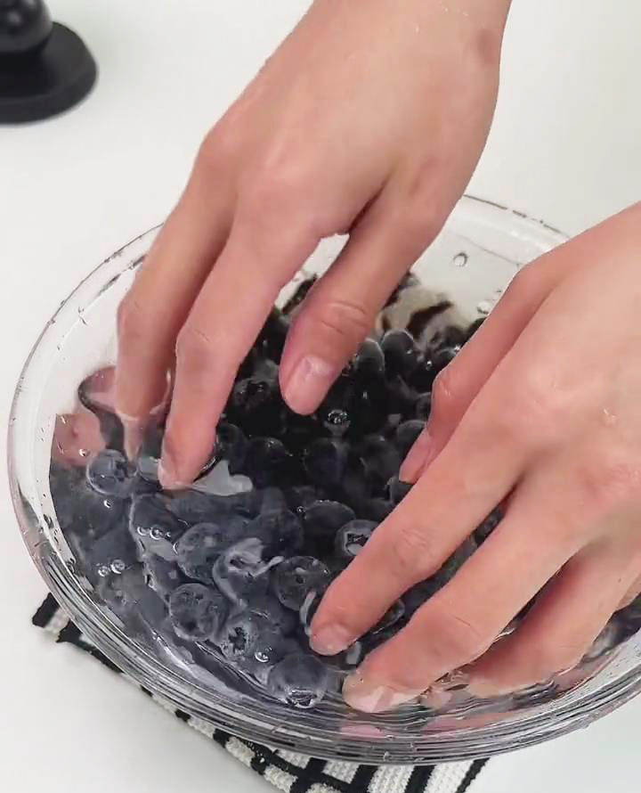 gently rinse blueberries using a bowl of clean water