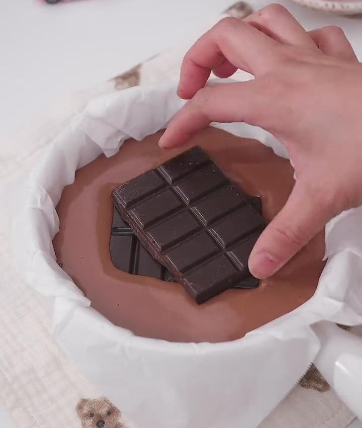 place 2 pieces of chocolate in the center of the batter