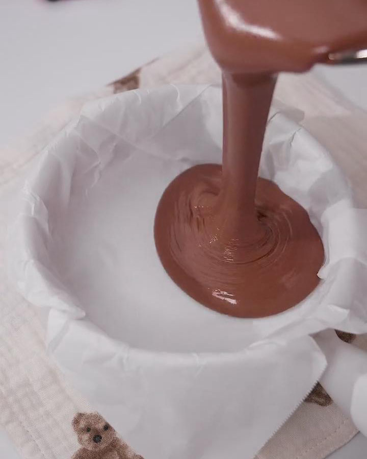 pour half of the batter into the prepared baking dish