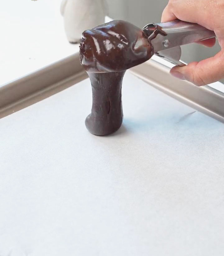 scoop small portions of the dough with a spoon and place them on the tray