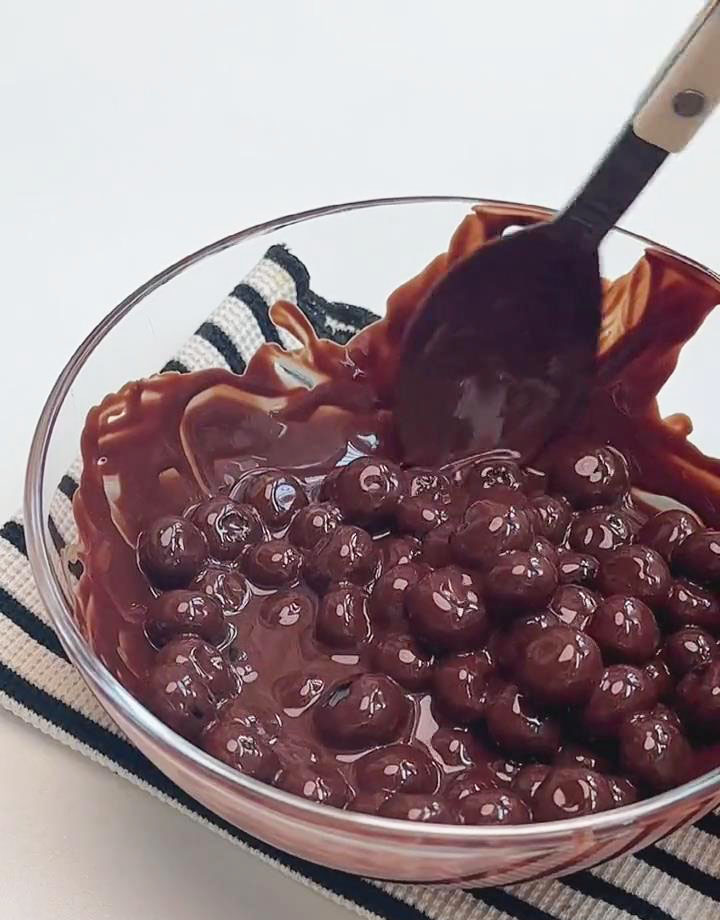 stir with a spoon to coat each blueberry evenly
