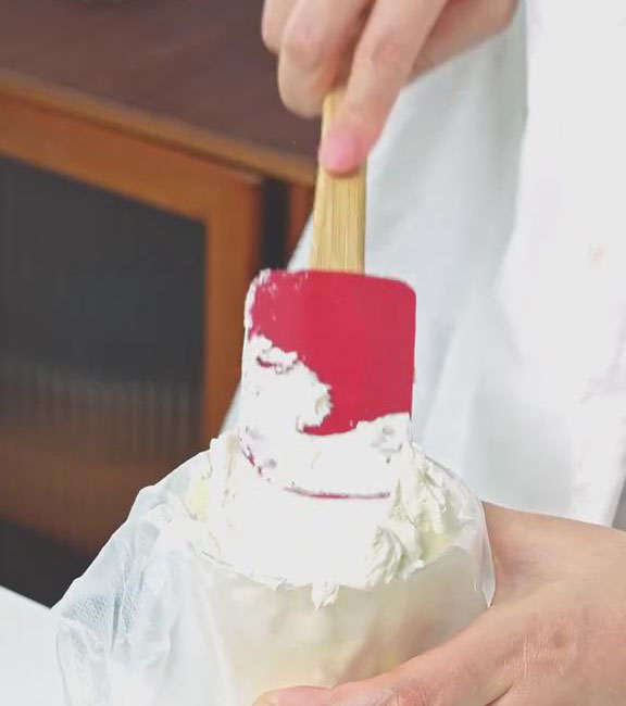 transfer the whipped cream into a piping bag for easy use
