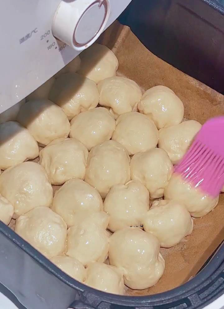 brush a layer of oil over the dough balls brush a layer of oil over the dough balls