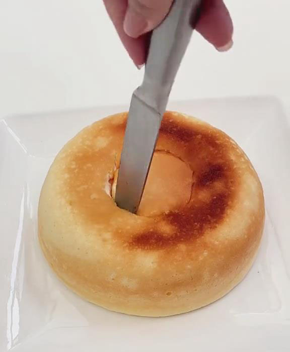 carve a small hole in the center of the cake