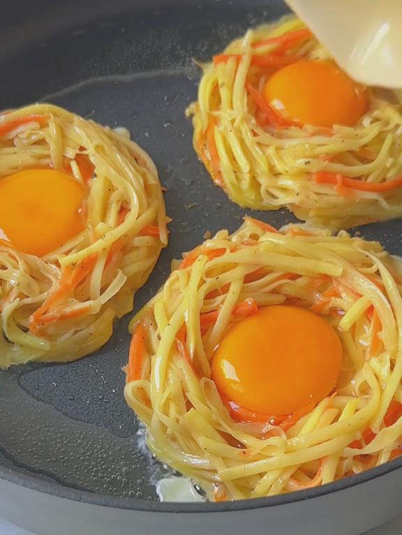 crack 1 egg into the center of the fritter