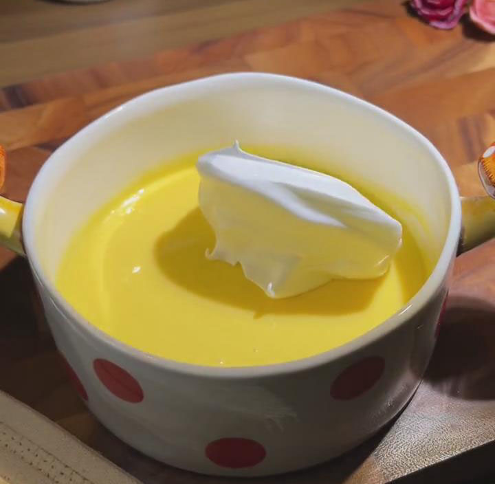 gently fold one third of the meringue into the yolk mixture