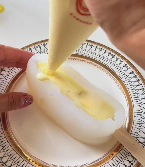 pipe the mixture into corn shaped molds pipe the mixture into corn shaped molds