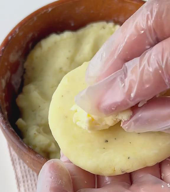 place some of the 100g shredded cheese in the center place some of the 100g shredded cheese in the center