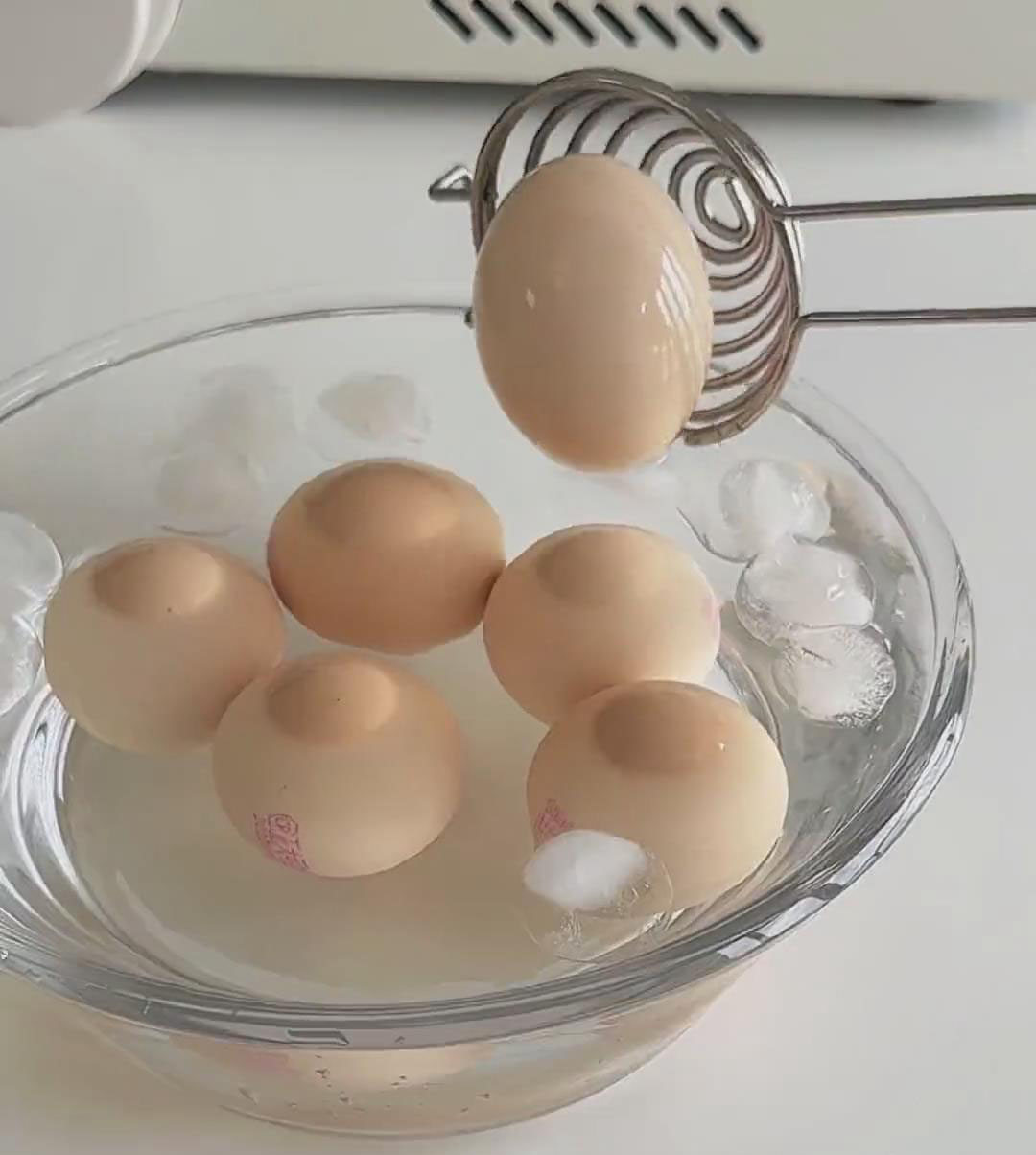 place the boiled eggs into an ice water bath