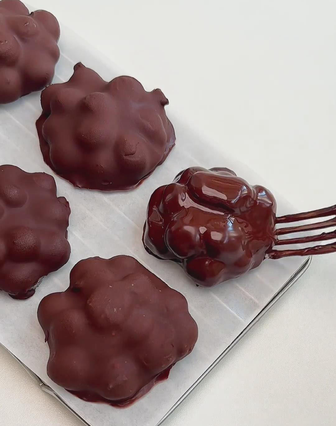 place the coated clusters on a tray lined with parchment paper