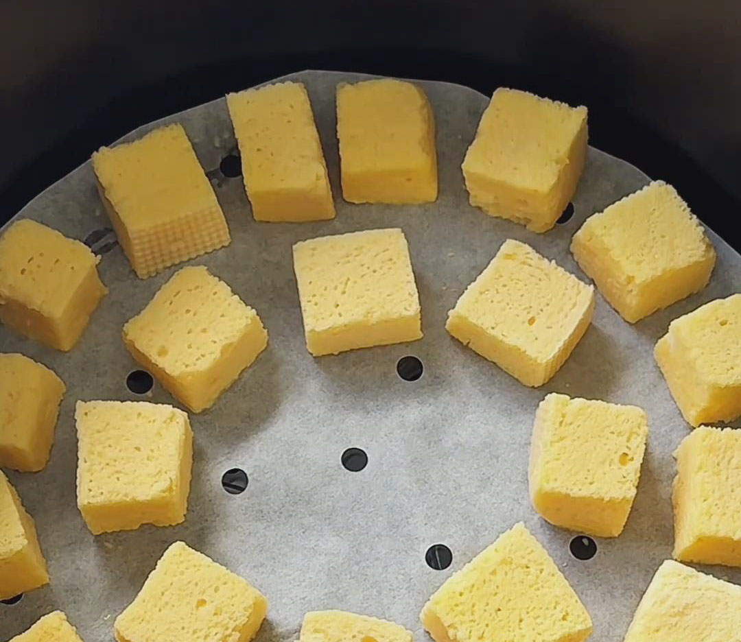 place the coated mantou cubes into the air fryer basket
