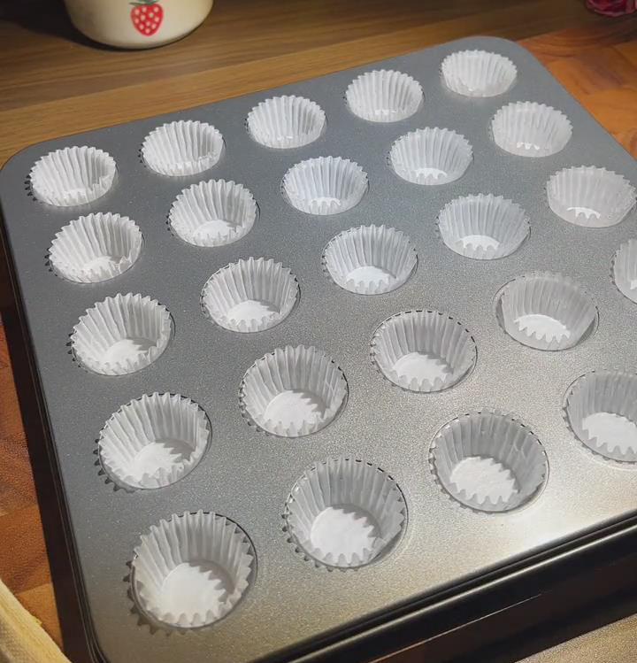 place the paper liners into the 25 cup baking mold