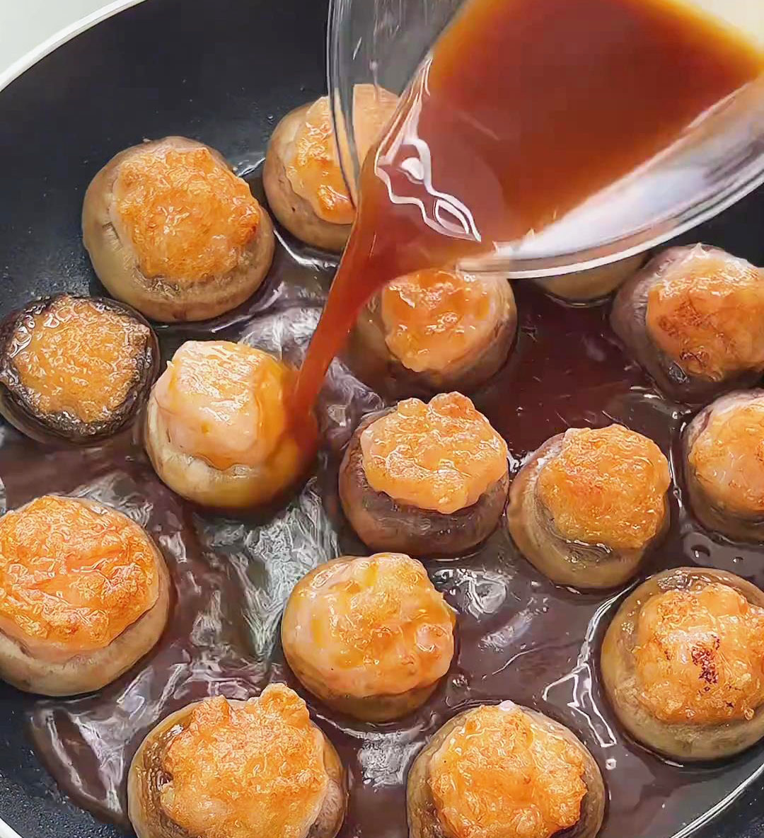pour the prepared sauce evenly over the mushrooms and shrimp paste pour the prepared sauce evenly over the mushrooms and shrimp paste