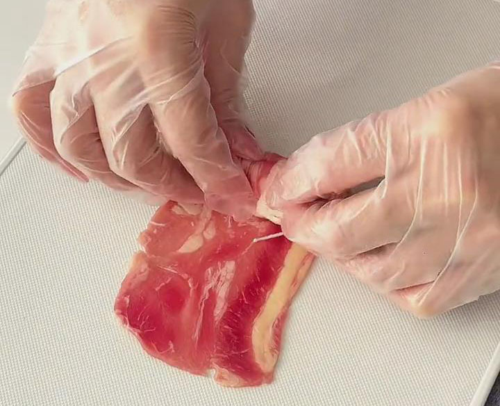 slowly roll it up tightly to completely enclose the mushrooms with the beef