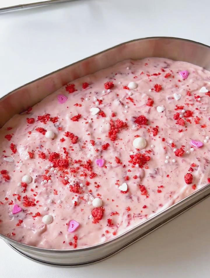 sprinkle freeze dried strawberry crumbs and sugar sprinkles on top