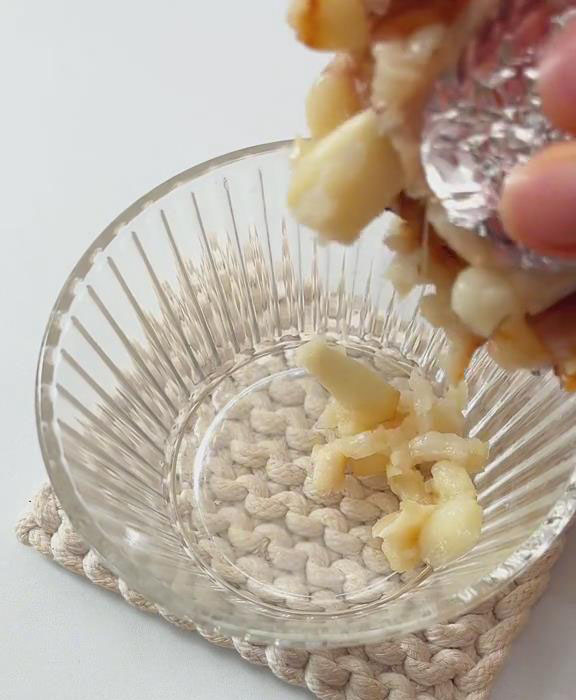 squeeze the roasted garlic into a small bowl