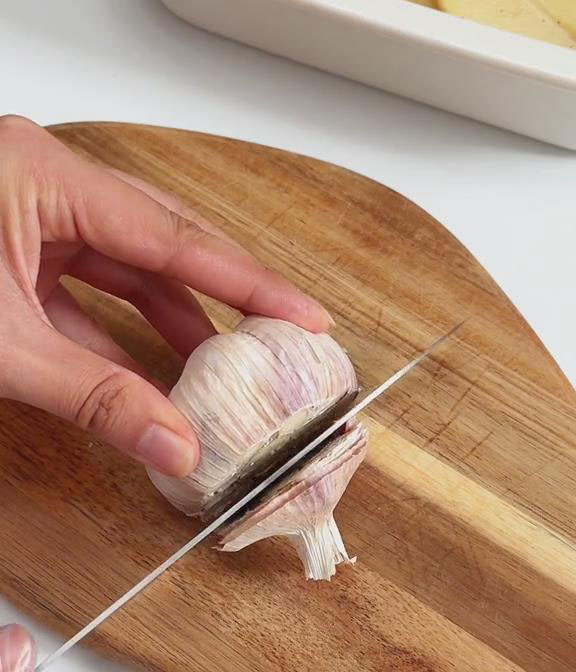 take 2 heads of garlic and cut off the top of each