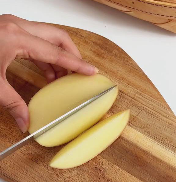 wash the potatoes and cut them into wedges