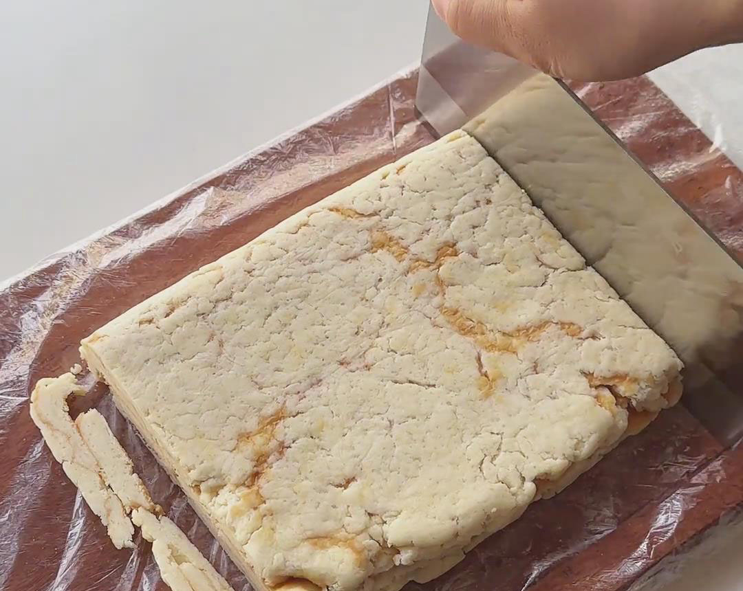 trim the edges of the dough to tidy it up trim the edges of the dough to tidy it up