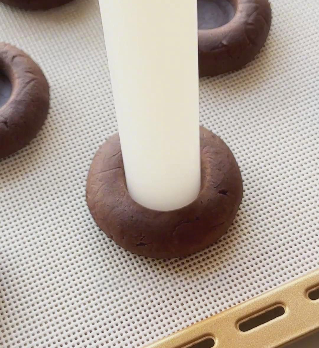flatten the balls lightly with a rolling pin